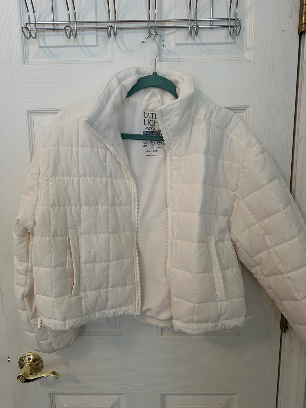 Cream colored light weight cropped puffer coat